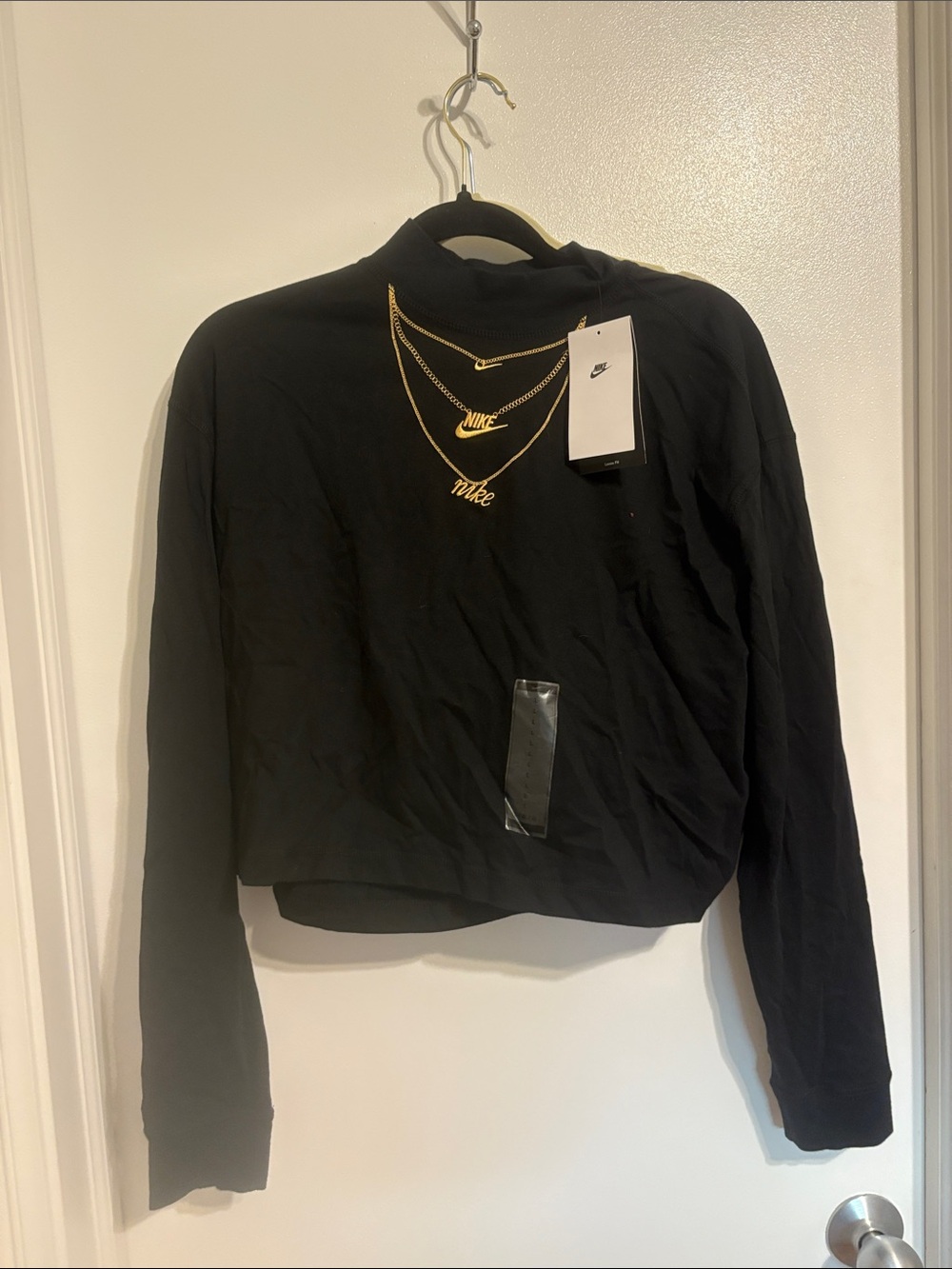 Nike Black Long-Sleeve Cropped Crew Top with Gold Accent